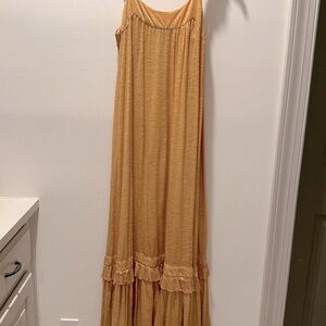 Maxi sundress in burnt gold color. Great loose but becoming fit. Size S